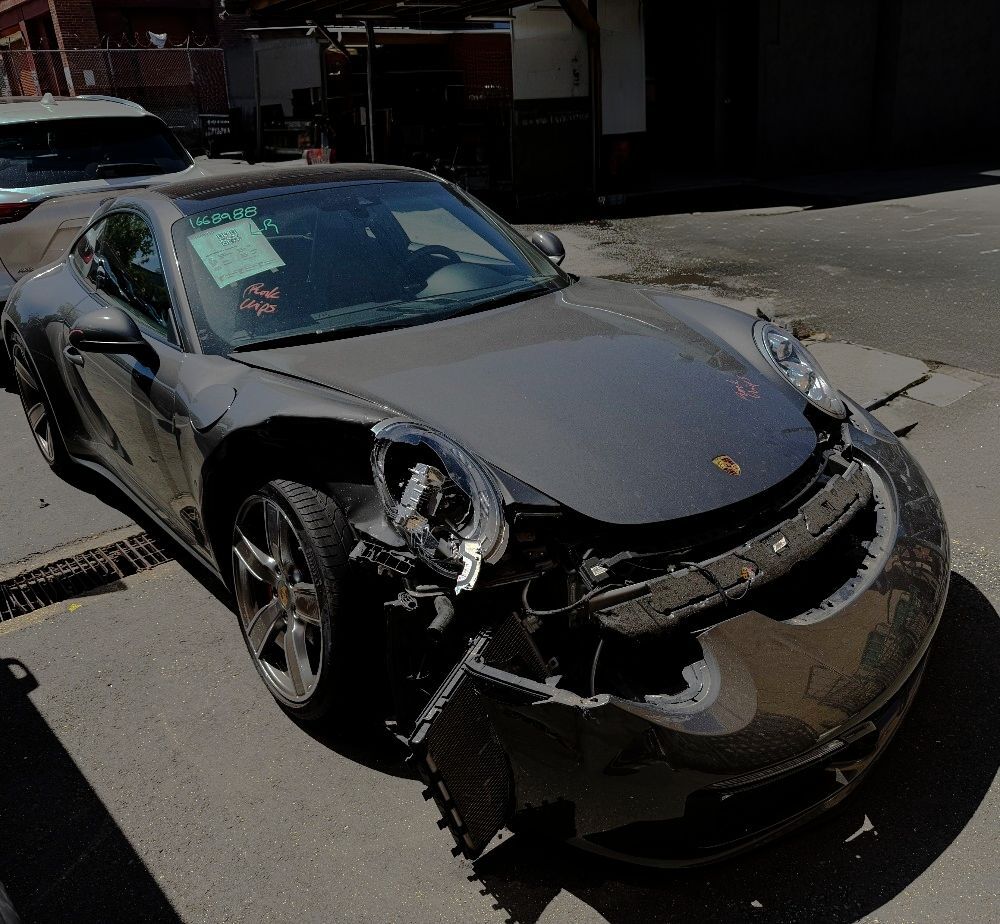 Dark-Gray-color-Porsche-waiting-on-Aluminum-Repair-Aliotos-Auto-Body