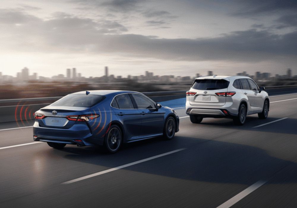 blue-and-white-toyota-cars-on-highway-showing-ADAS-working-Aliotos-Auto-Body.