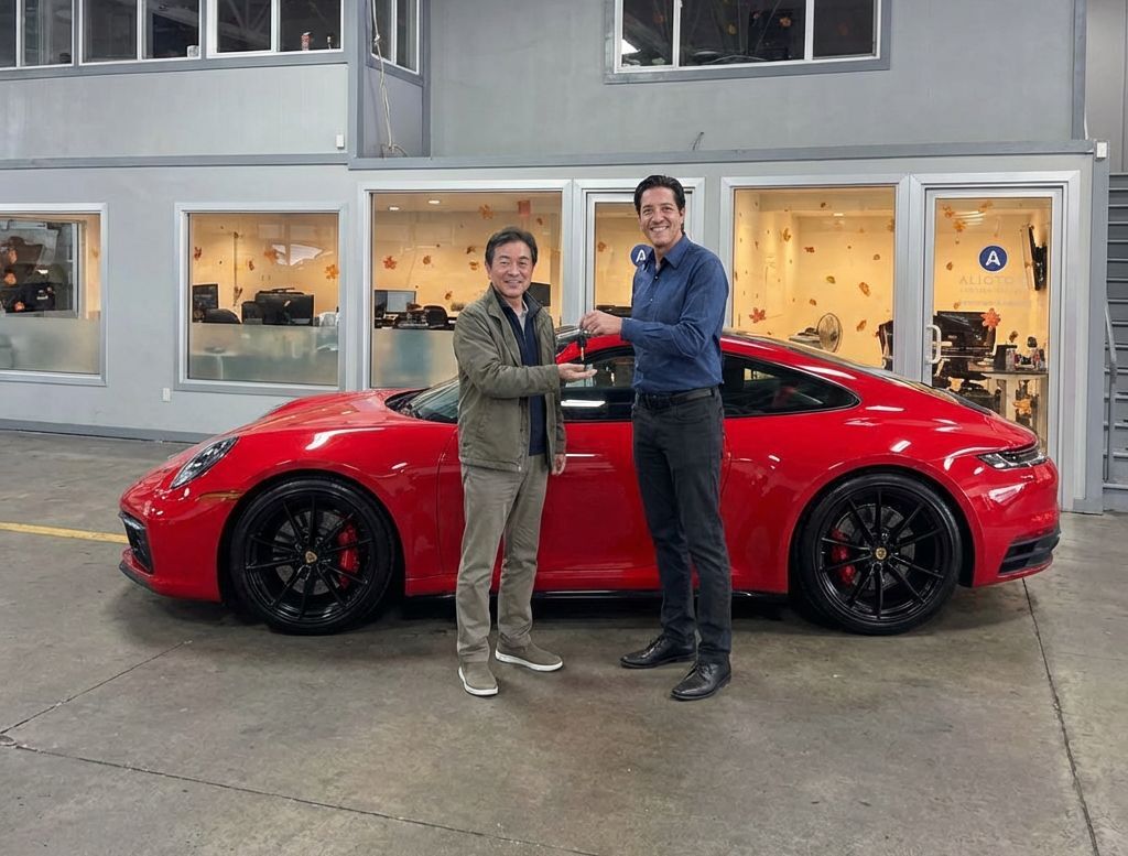 Chris-Alioto-handing-keys-to-a-customer-after-auto-body-repair-to-his-Porsche-at-Aliotos-Folsom-Street-Location