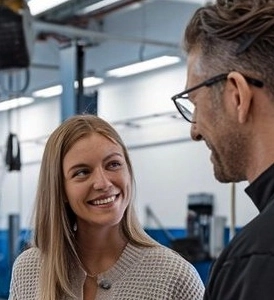 Customer-with-auto-body-technician-smiling-at-Aliotos-Auto-Body
