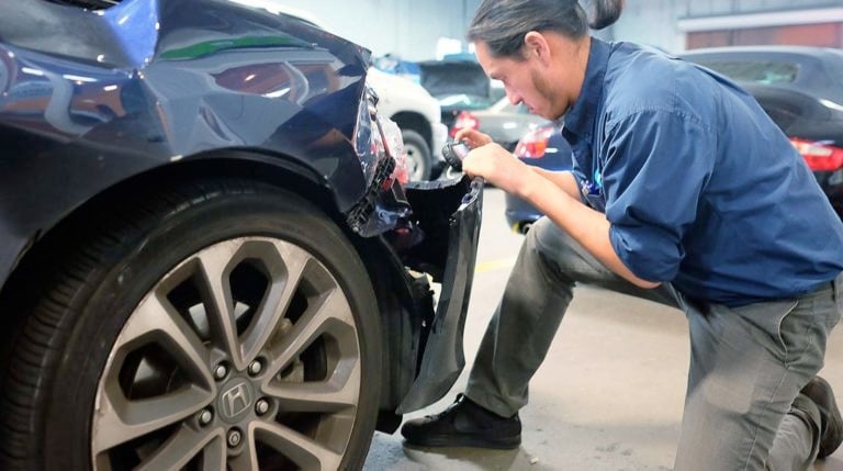honda certified collision repair tech working