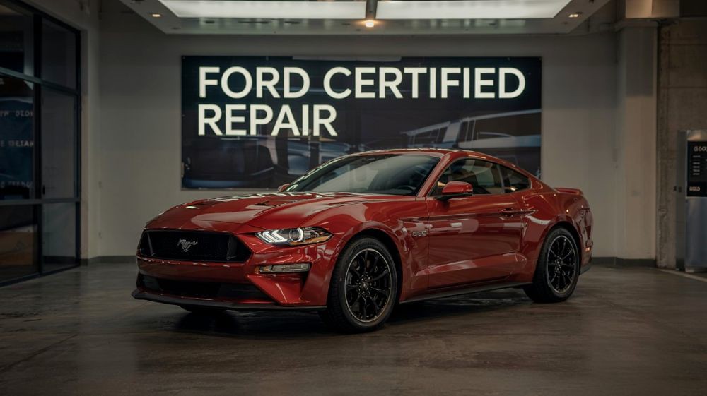 Red-Mustang-sitting-by-a-Ford-Certified-Repair-sign-at-Aliotos-Auto-Body-San-Francisco